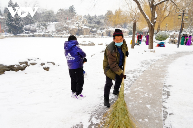 Bắc Kinh ngập trong tuyết trước thềm Olympic mùa đông - Ảnh 13.