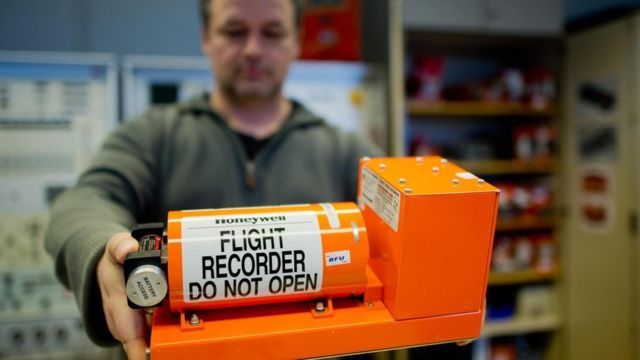 Why is the plane's black box not black, but orange?  - Photo 1.