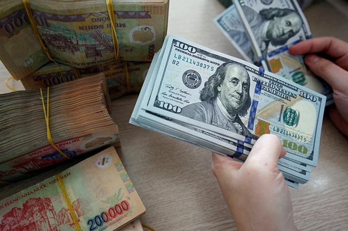 Tiền VND tăng giá so với USD - Ảnh 1.