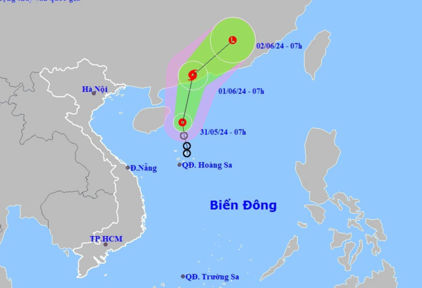 Áp thấp nhiệt đới khả năng mạnh lên thành bão trên Biển Đông- Ảnh 1.
