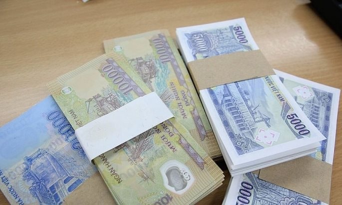 Người đổi tiền lẻ, tiền mới để lì xì dịp Tết có thể vi phạm pháp luật, bị phạt tiền đến 40 triệu đồng trong trường hợp sau- Ảnh 1.