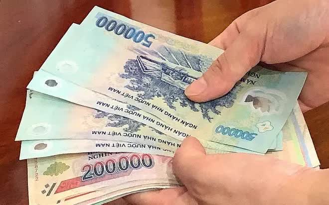 Nghỉ việc do bão lũ, ngập nước, người lao động có được nhận lương? - Ảnh 1.