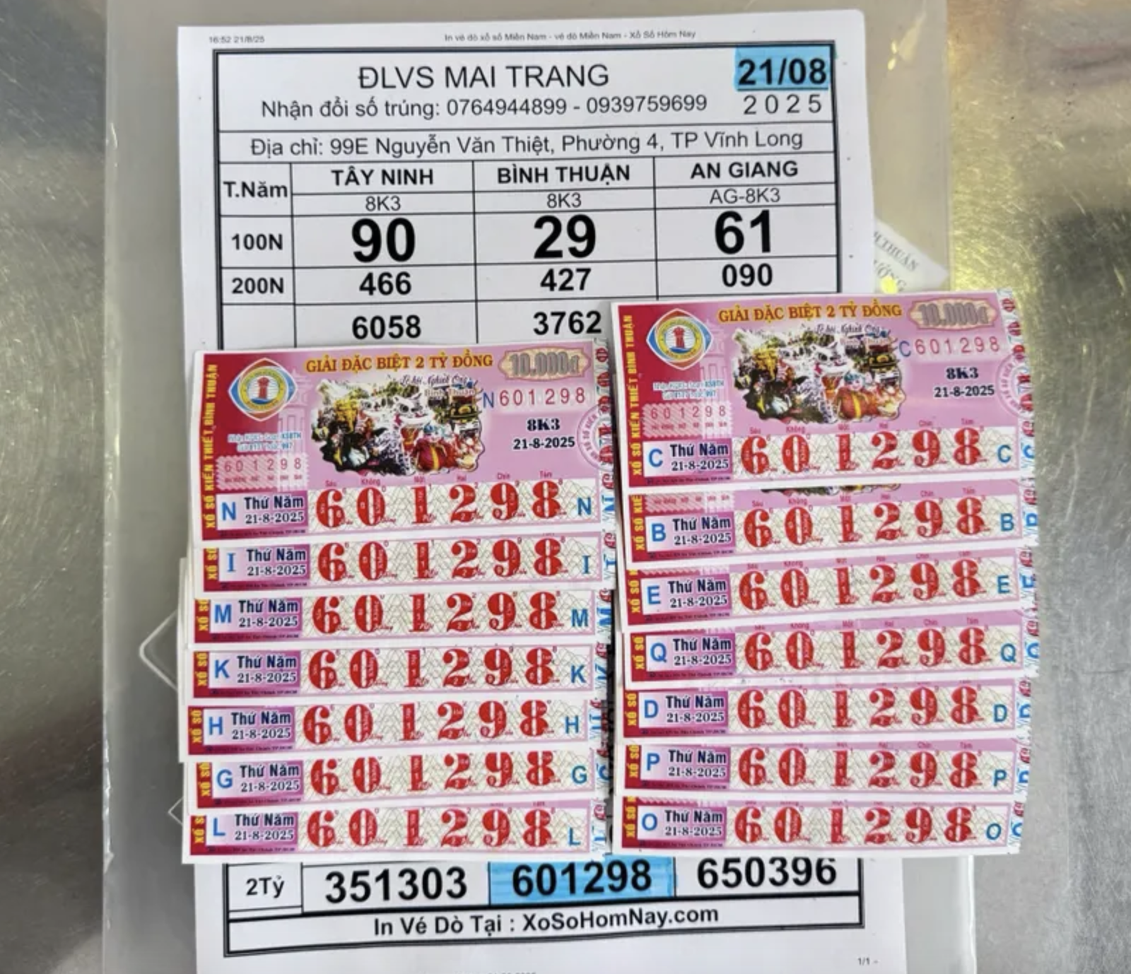 Một công nhân ở Vĩnh Long trúng 14 tờ vé số giải độc đắc - Ảnh 1.