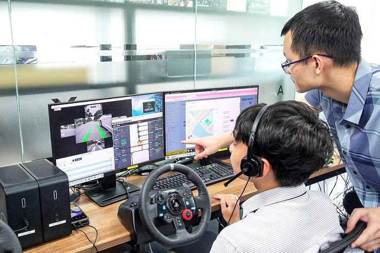Hà Nội thử nghiệm xe buýt tự hành và robot giao hàng năm 2026 - Ảnh 3. Hà Nội thử nghiệm xe buýt tự hành và robot giao hàng năm 2026 - Ảnh 3.