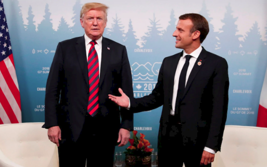 Tay ông Trump hằn đỏ sau cú bắt tay với Tổng thống Pháp - Ảnh 2.