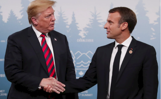 Tay ông Trump hằn đỏ sau cú bắt tay với Tổng thống Pháp - Ảnh 5.