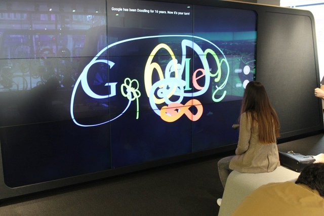 The shop also has lots of quirks and experimental pieces of tech for curious customers to play with. This is the &quot;doodle wall,&quot; where people can use virtual spray paint to make murals.