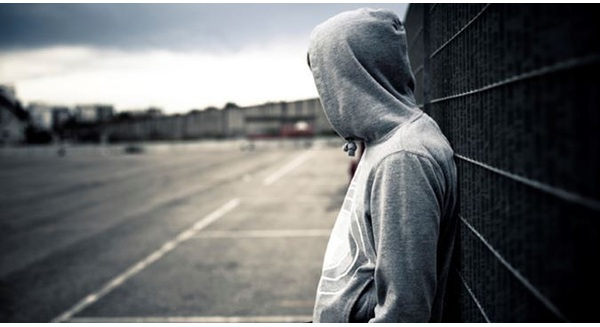 depressed-teen-hoodie-school-istock-1474686165975-crop-1474686252492.jpg
