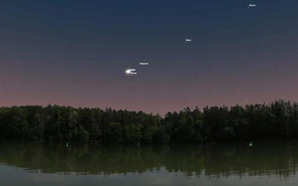 At dawn, the sky appears 2 merging planets