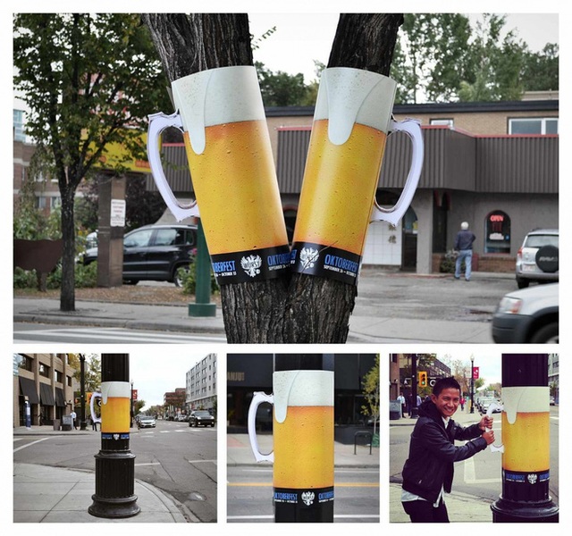  Ly bia trào bọt in trên tấm poster kiểu mới, quấn quanh gốc cây để quảng cáo cho lễ hội bia nổi tiếng Oktoberfest ở Đức. 