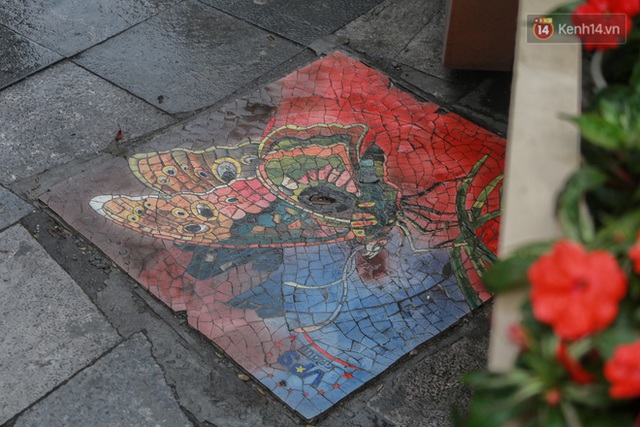 Ảnh: Nắp cống, hố ga “vô tri, vô giác” tại phố đi bộ Hà Nội biến thành tác phẩm nghệ thuật đẹp như tranh vẽ - Ảnh 7.