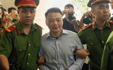 Nụ cười khó hiểu của Shark Bình khi bị dẫn giải đến tòa