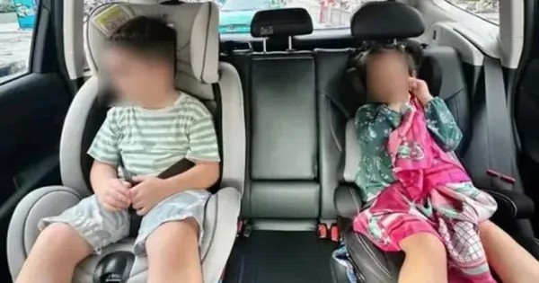 Người lớn ngồi ghế phụ ô tô có được ôm trẻ em ngồi cùng không? Cục CSGT giải đáp